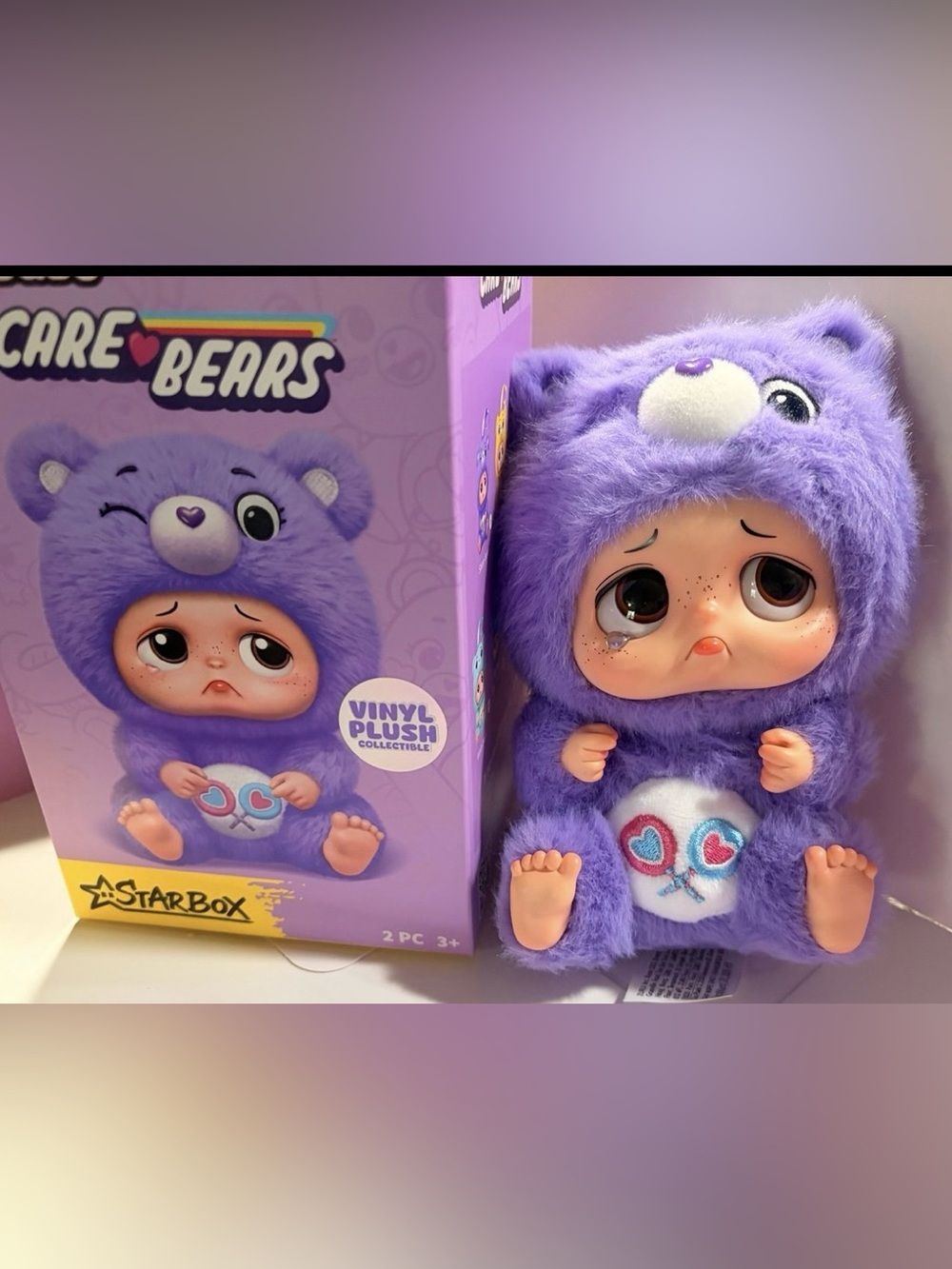 Purple. Sad baby Care Bear